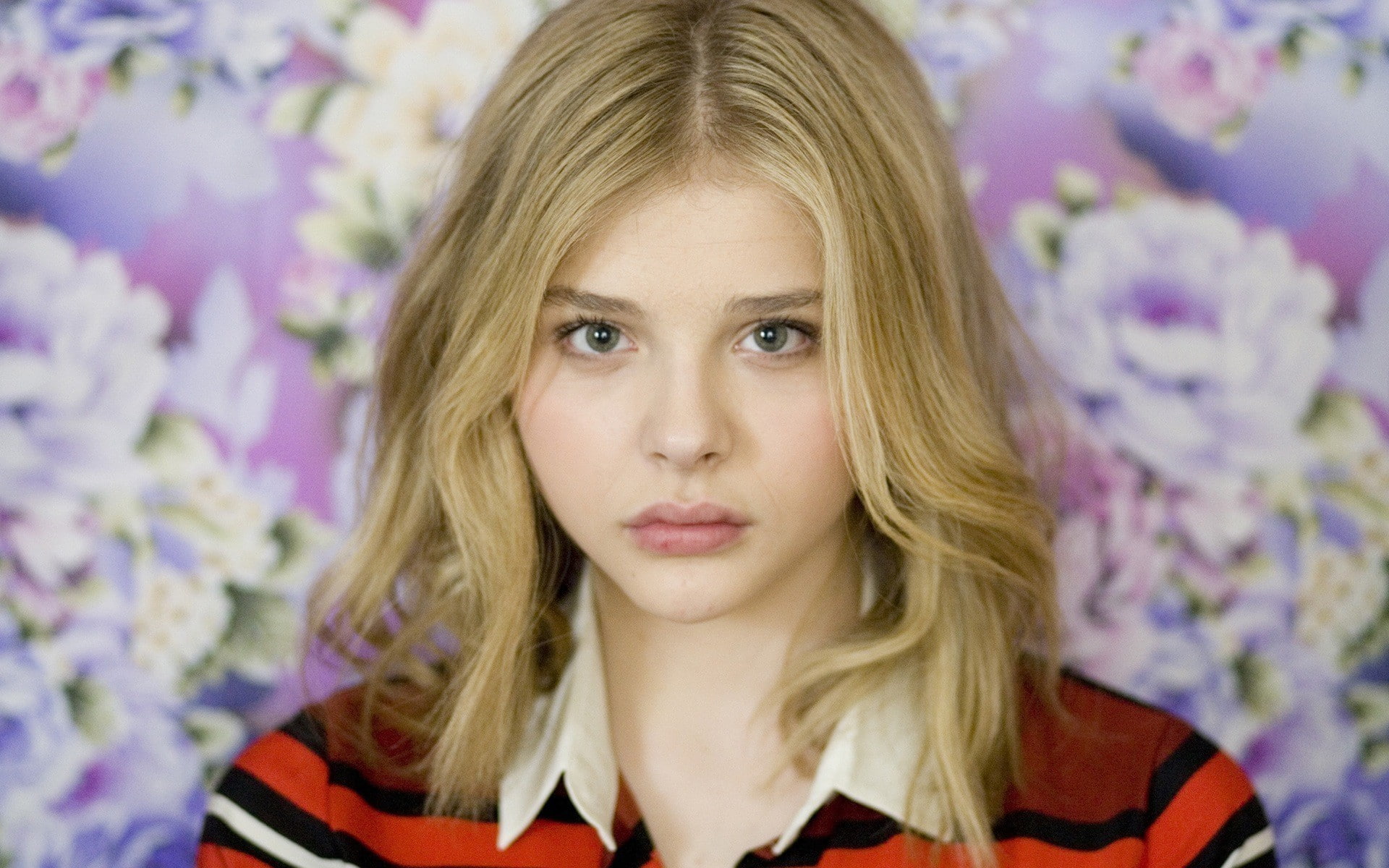 blond hair, chlo grace moretz blonde women actress celebrity, emotion, headshot, contemplation, looking at camera, long hair, close-up, adult, floral pattern, HD Wallpaper