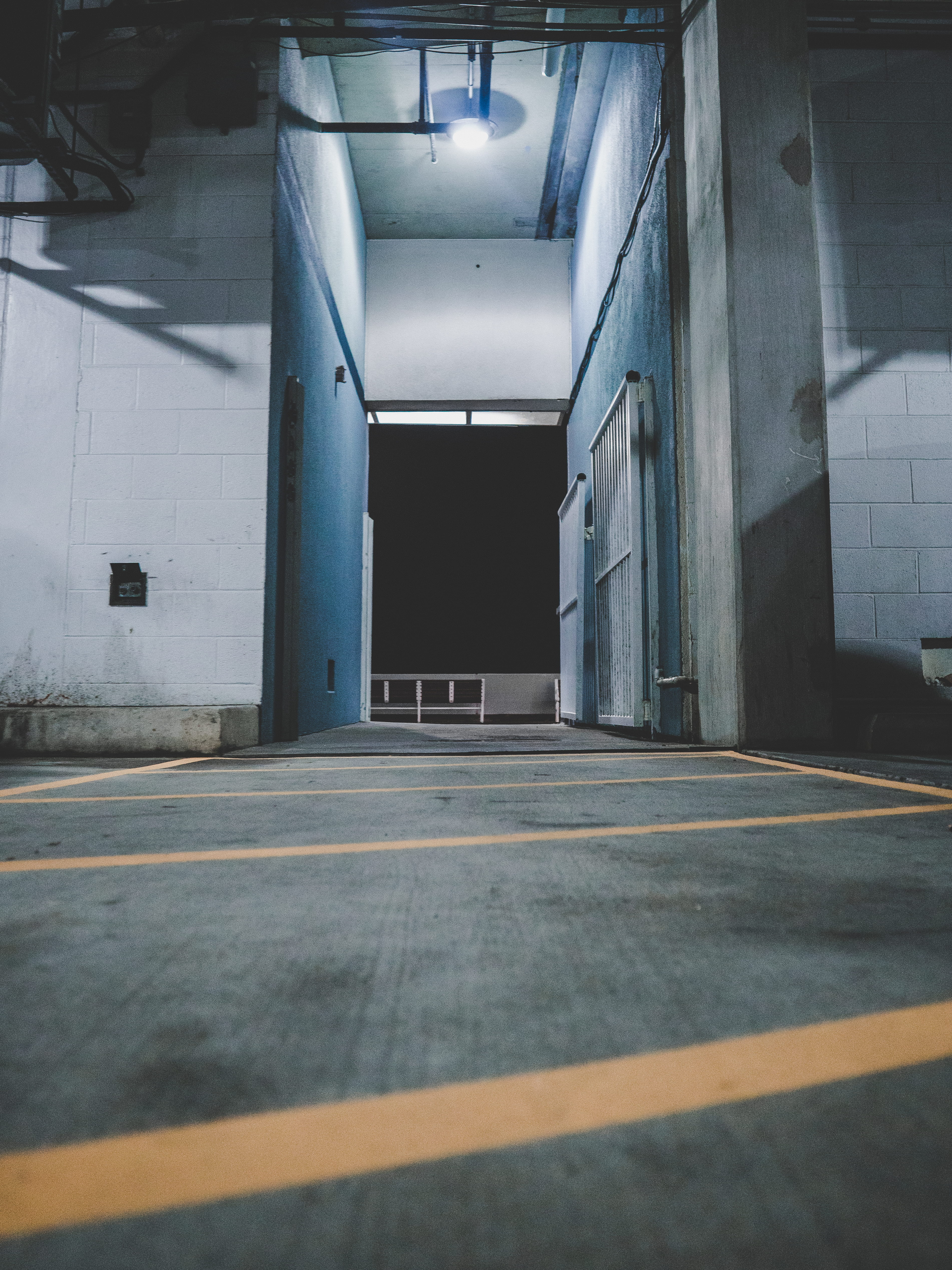 indoors, ocean city by night, ceiling, architectural column, road marking, public transportation, illuminated, 4K, flooring, no people, sign, parking lot, Phone HD Wallpaper
