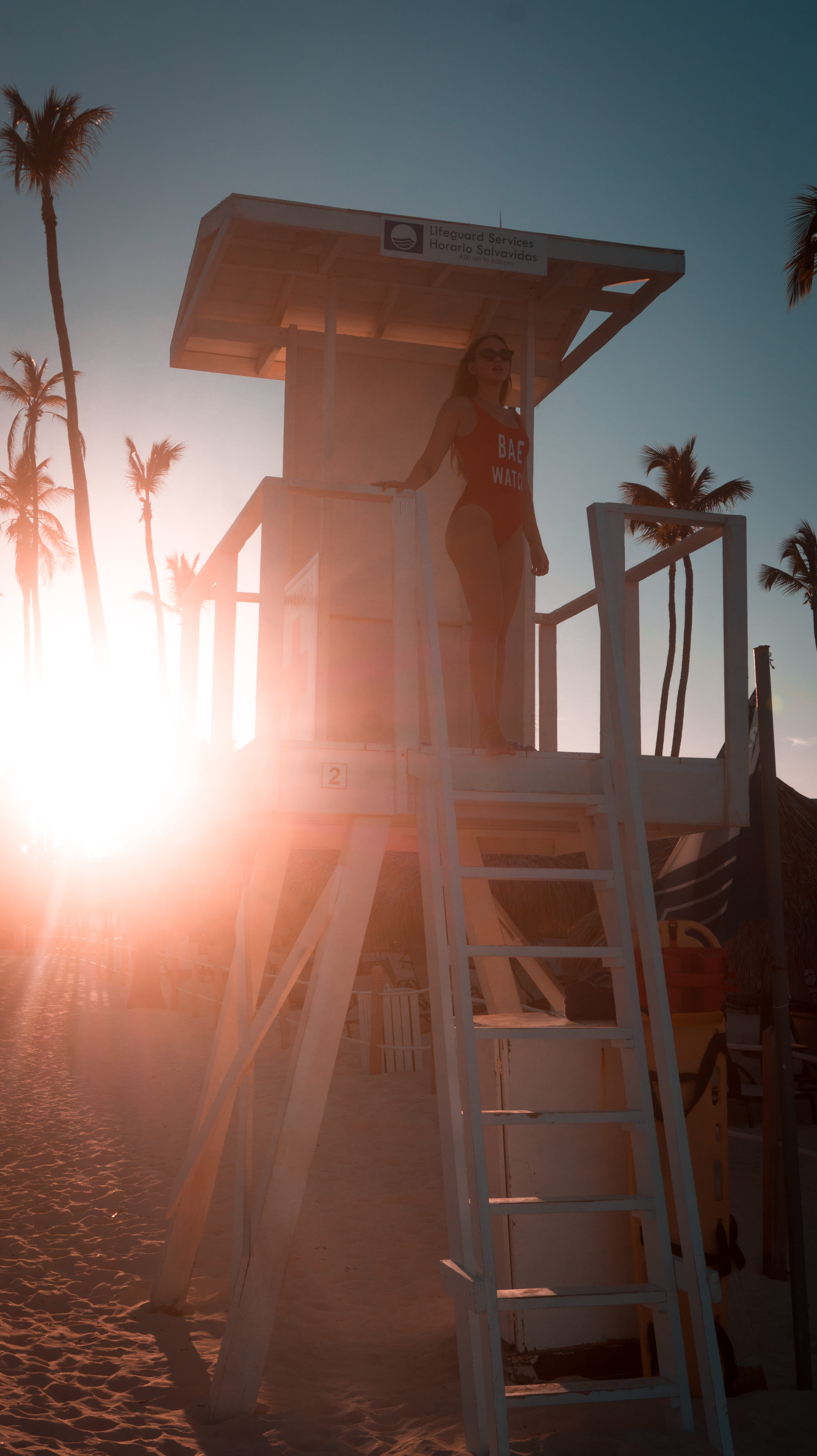 nature, lifeguard, sunbeam, wood - material, lifeguard station, sunset, leisure activity, built structure, low angle view, palm trees, human, sunrise, light, Phone HD Wallpaper