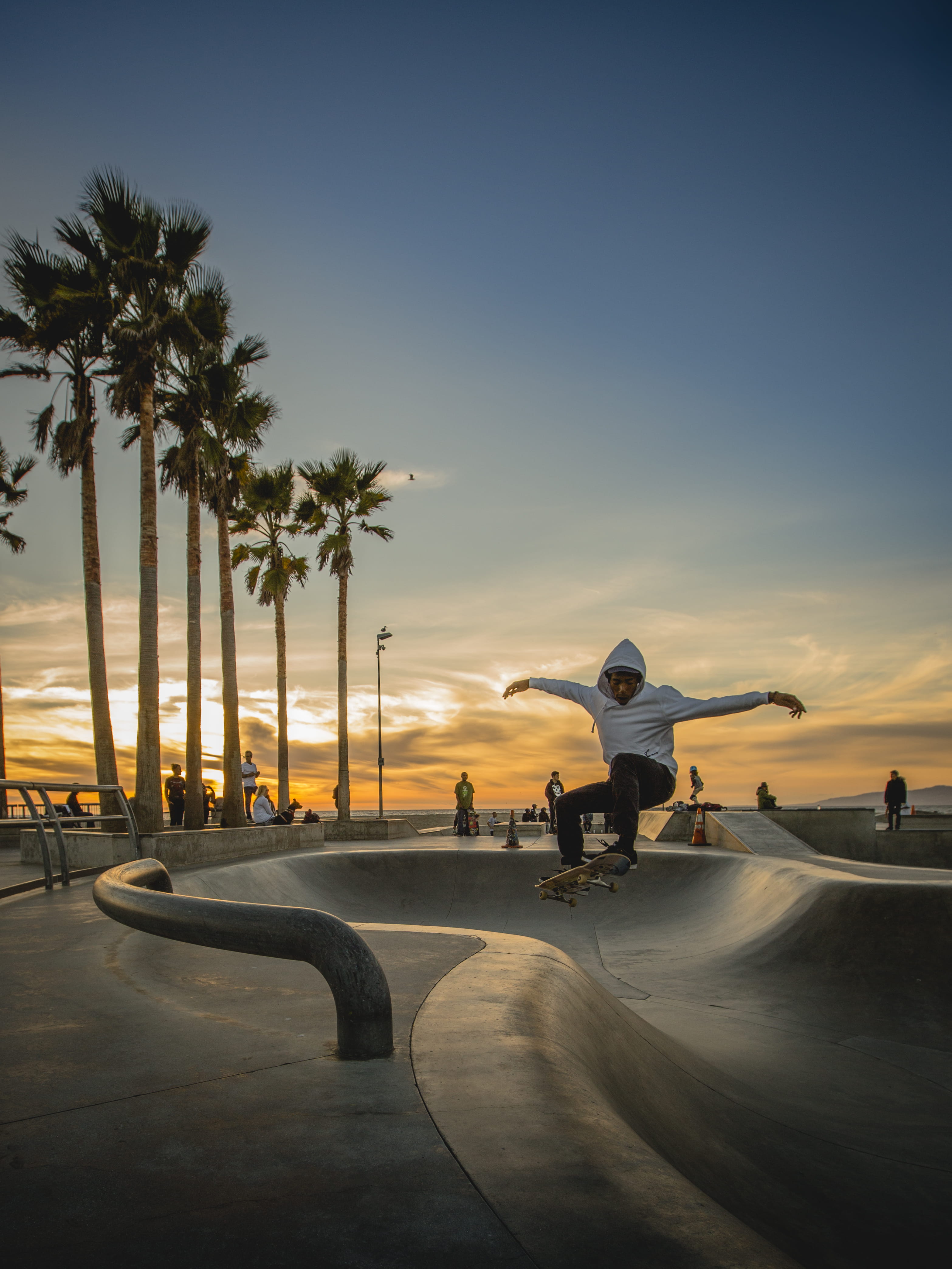 sunset, 4K, skateboard park, nature, skateboard, people, motion, sport, men, sky, land, tree, full length, tropical climate, leisure activity, los angeles, Phone HD Wallpaper