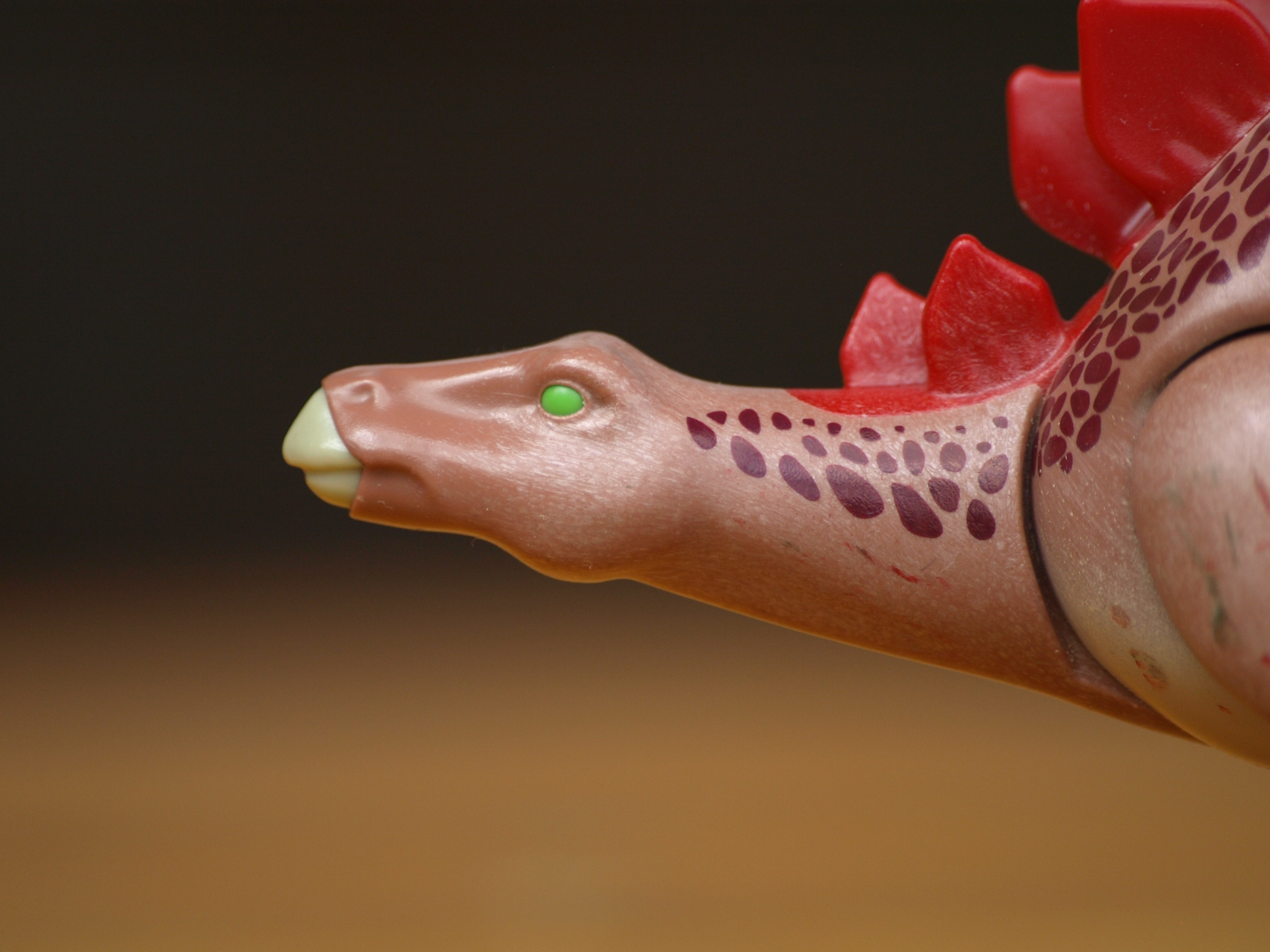 side view, studio shot, adult, one person, red, 2K, dinosaur, women, hand, black background, replica, human body part, pink, human hand, one animal, human limb, HD Wallpaper