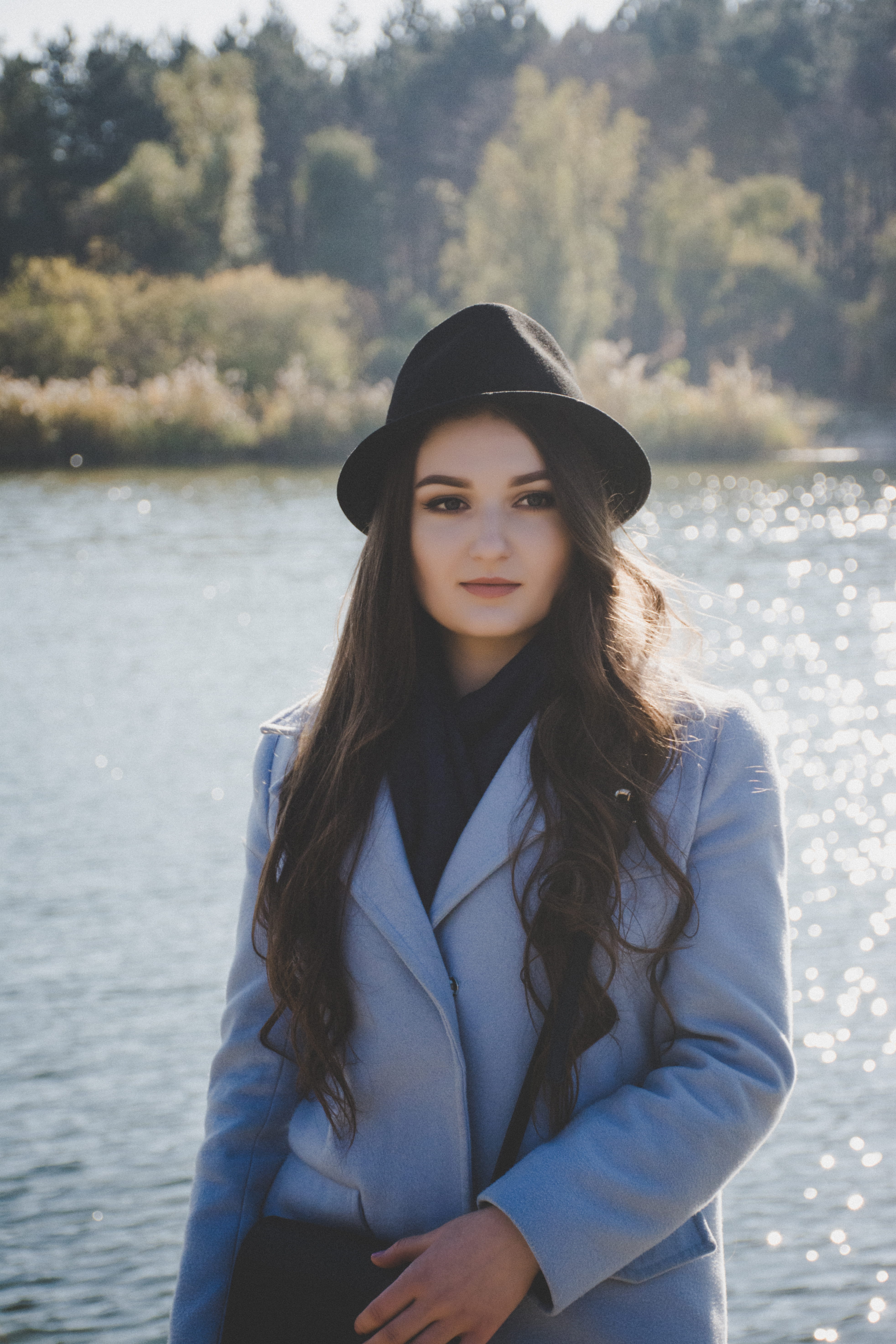 portrait, outdoors, standing, hairstyle, water, sun, vintage, long hair, warm clothing, fashion, sunlight, clothing, front view, sunglow, longhair, leisure activity, Phone HD Wallpaper