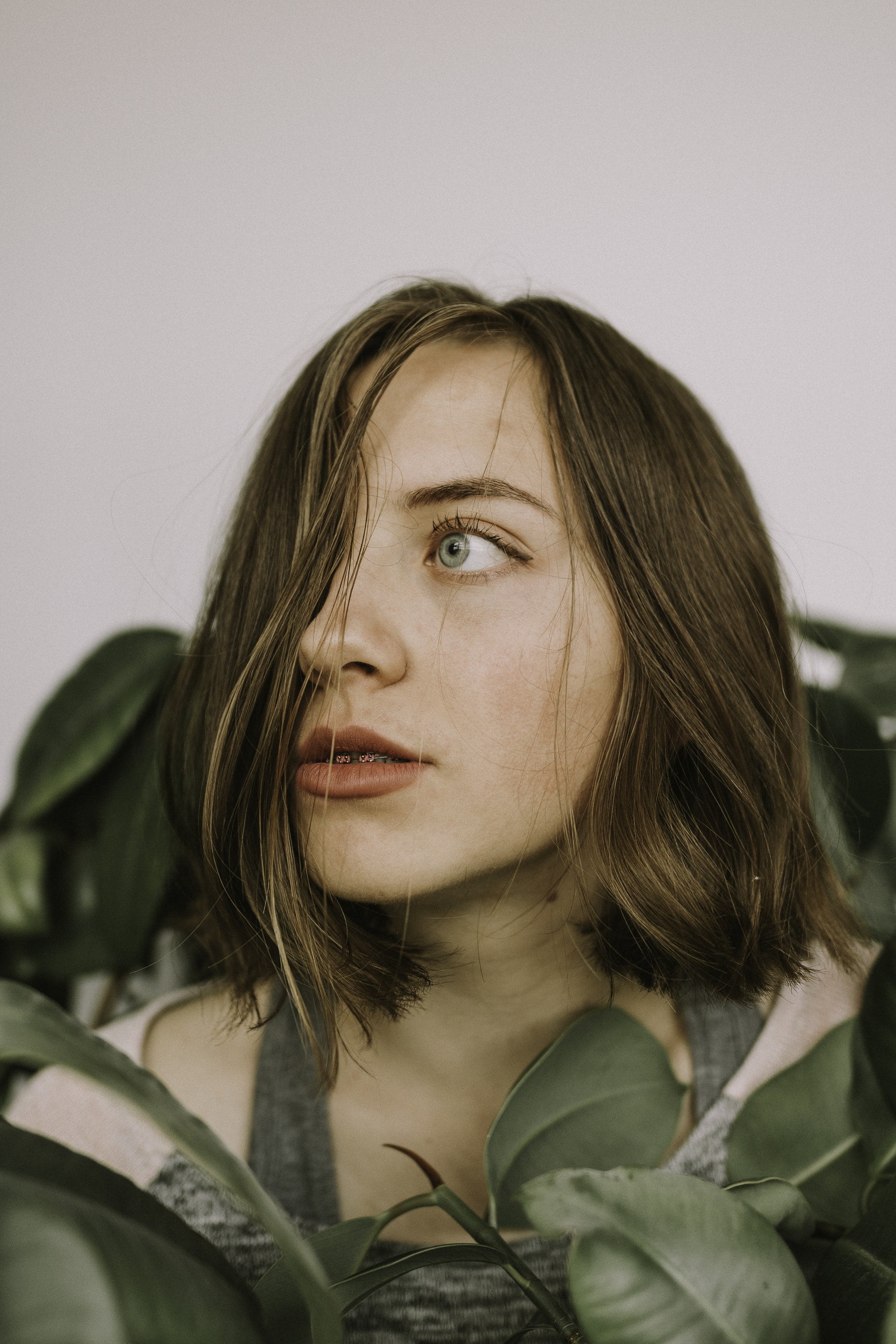 young adult, close-up, beauty, front view, beautiful woman, one person, portrait, clothing, brown hair, contemplation, looking, headshot, hood - clothing, Phone HD Wallpaper