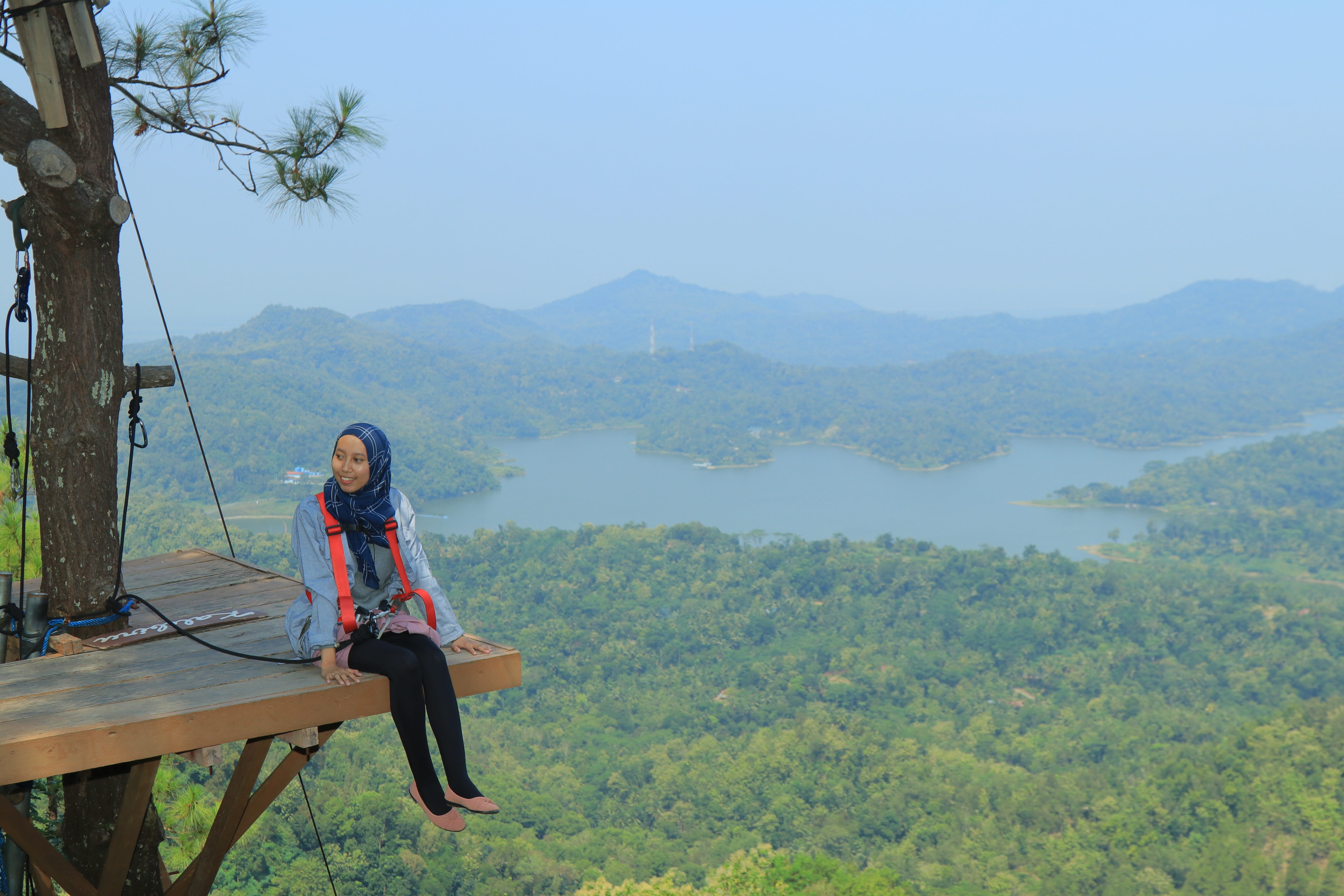 lifestyles, real people, full length, happiness, favourite, outdoors, explore, lake, view, green, sitting, plant, 5K, tranquil scene, wonderful, kalibiru, HD Wallpaper