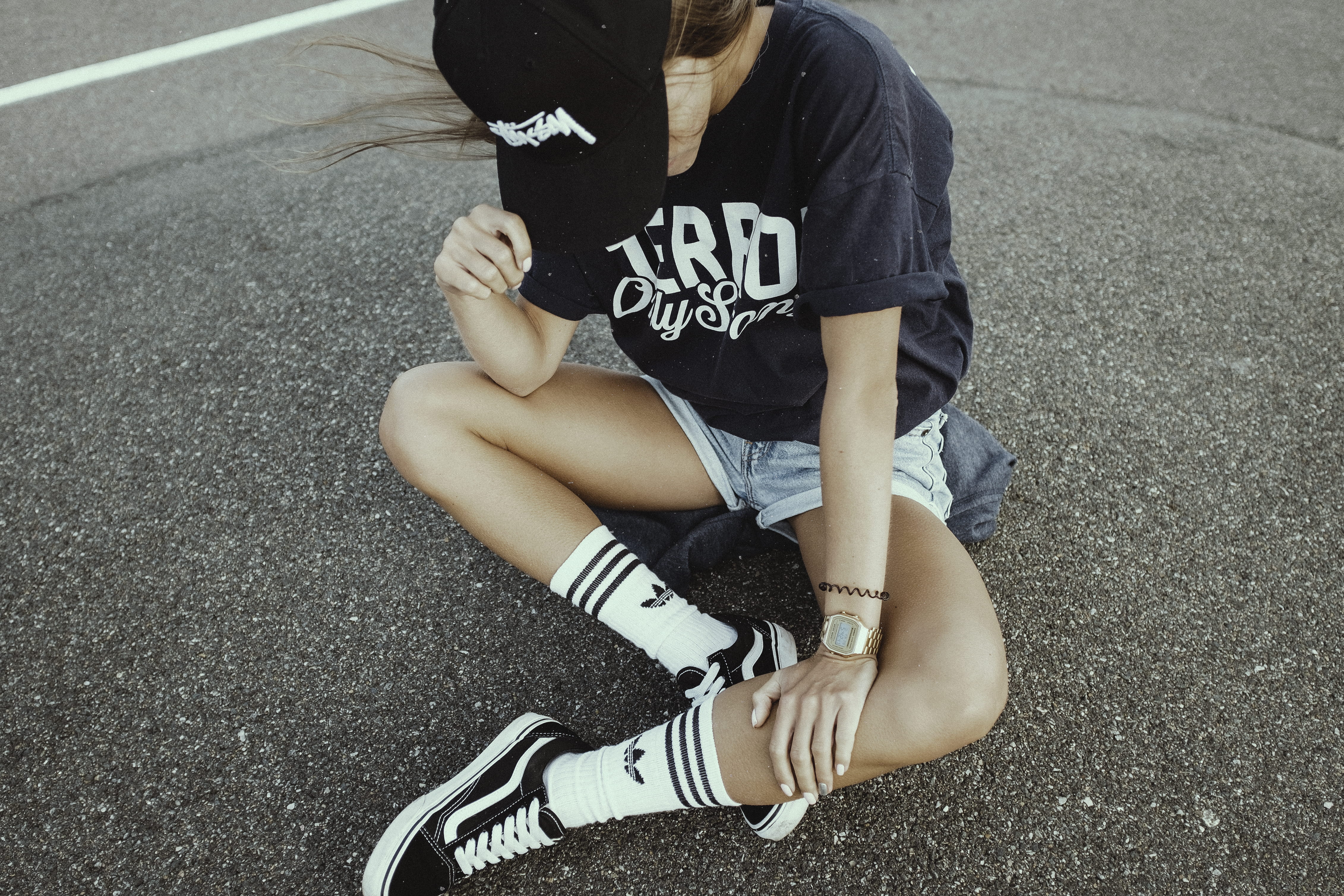 high angle view, adidas, girl, road, shoe, text, gray, urban, obscured face, looking down, outdoor, women, woman, white, crew, sitting, communication, wearing, HD Wallpaper