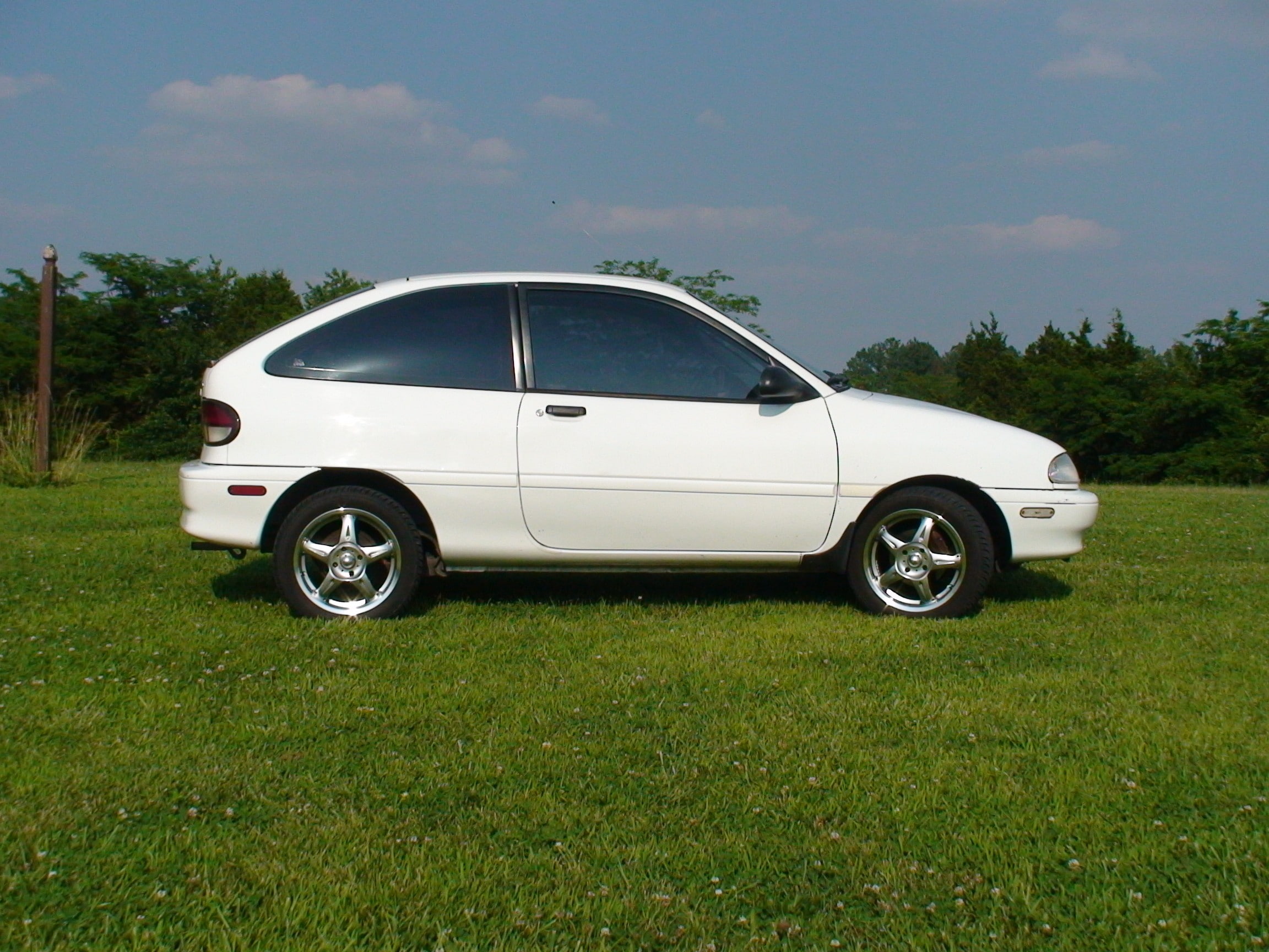 tree, green color, white color, Wheels, motor vehicle, outdoors, white, field, Aspire, Custom, side view, Ford, sky, land vehicle, stationary, no people, HD Wallpaper