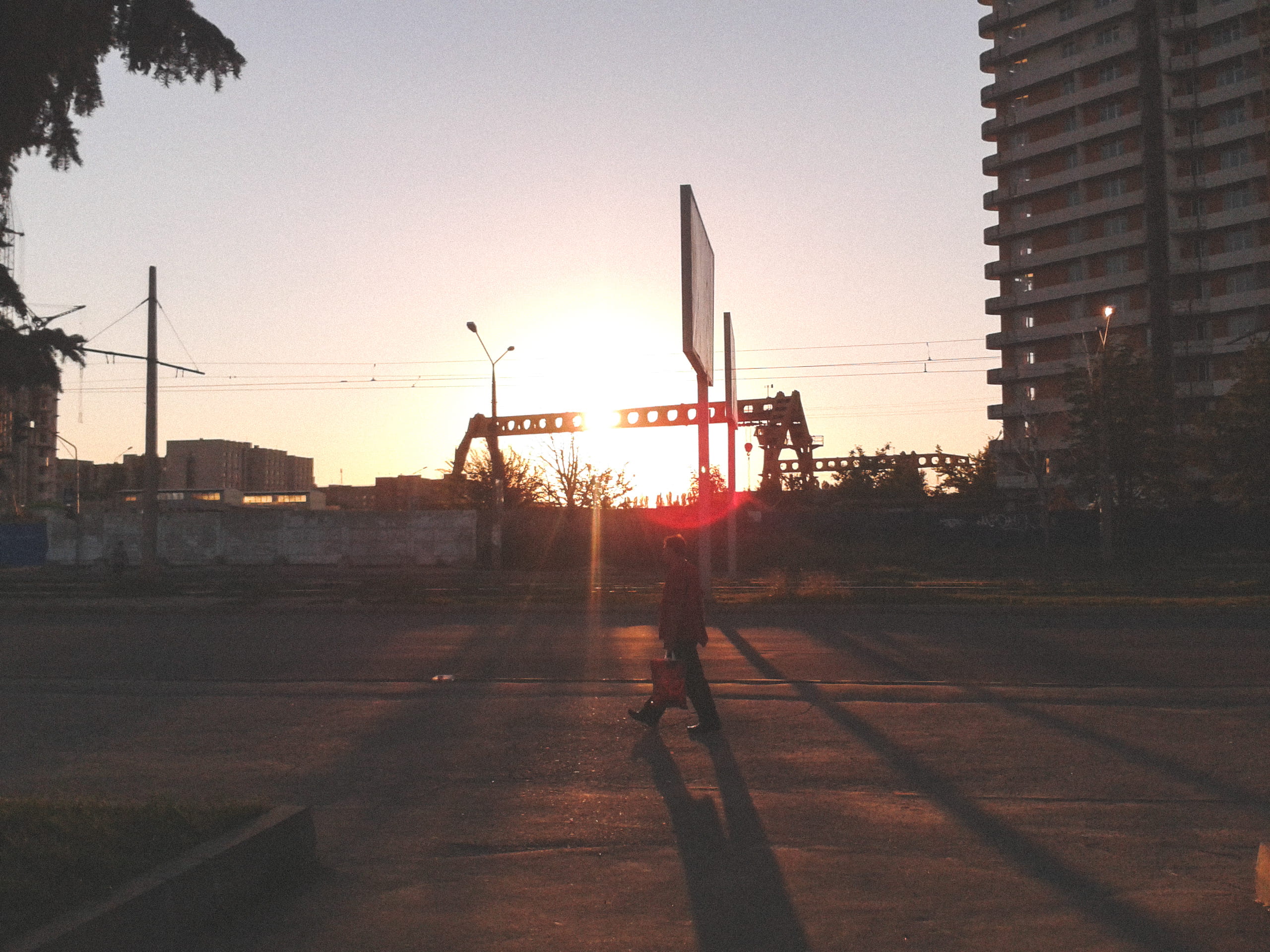 real people, footpath, building, kharkiv, skyscraper, sunlight, street, ukraine, men, sunset, building exterior, architecture, road, lens flare, built structure, HD Wallpaper