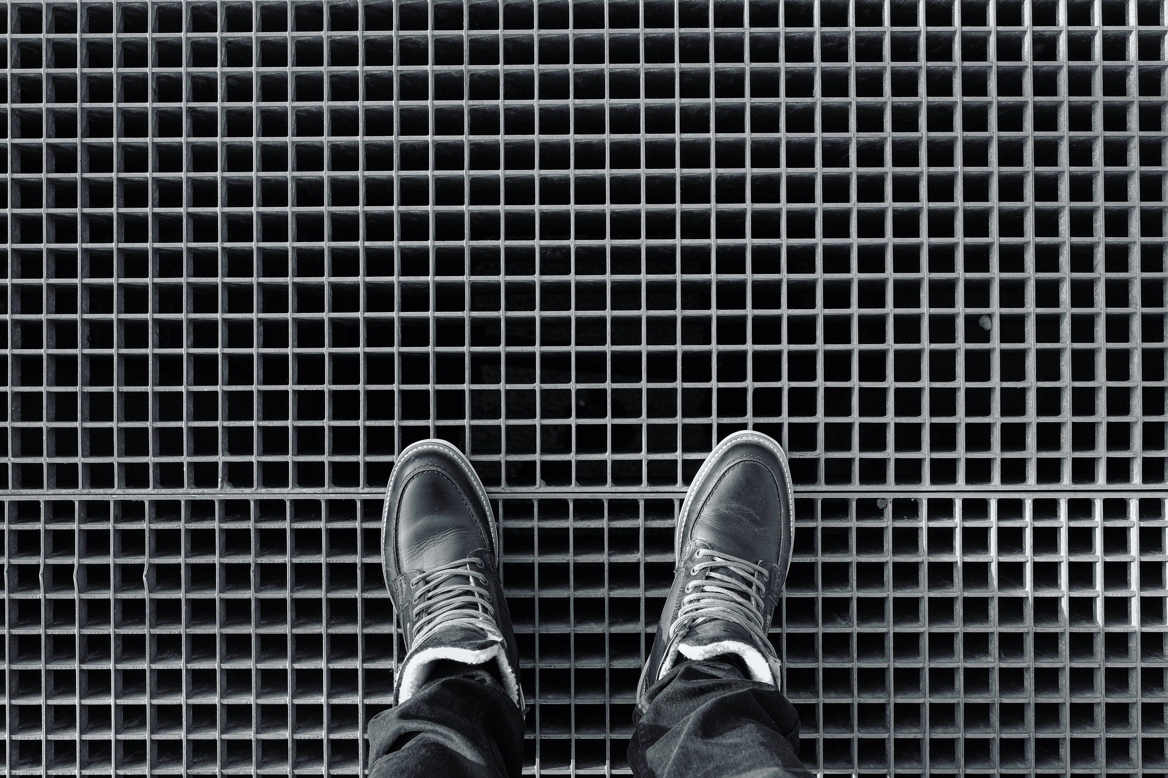 lifestyles, one person, pattern, tile, standing, human foot, jeans, body part, leisure activity, shoe, pair, boots, black, shoes, men, high angle view, HD Wallpaper