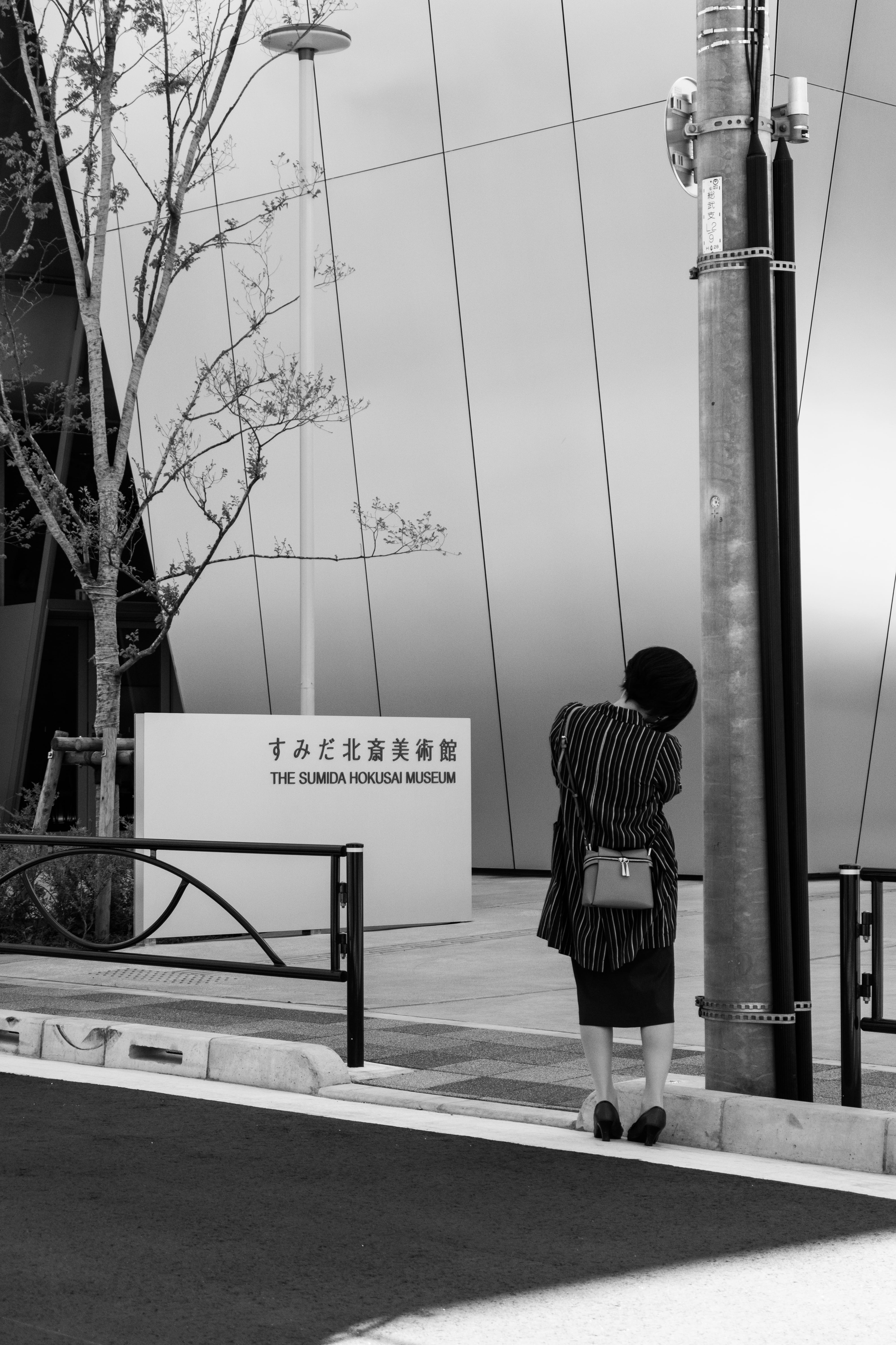 black and white, western script, architecture, person, sumida hokusai museum, technology, real people, hokusai, vehicle, road, city, outdoors, cable, post, Phone HD Wallpaper