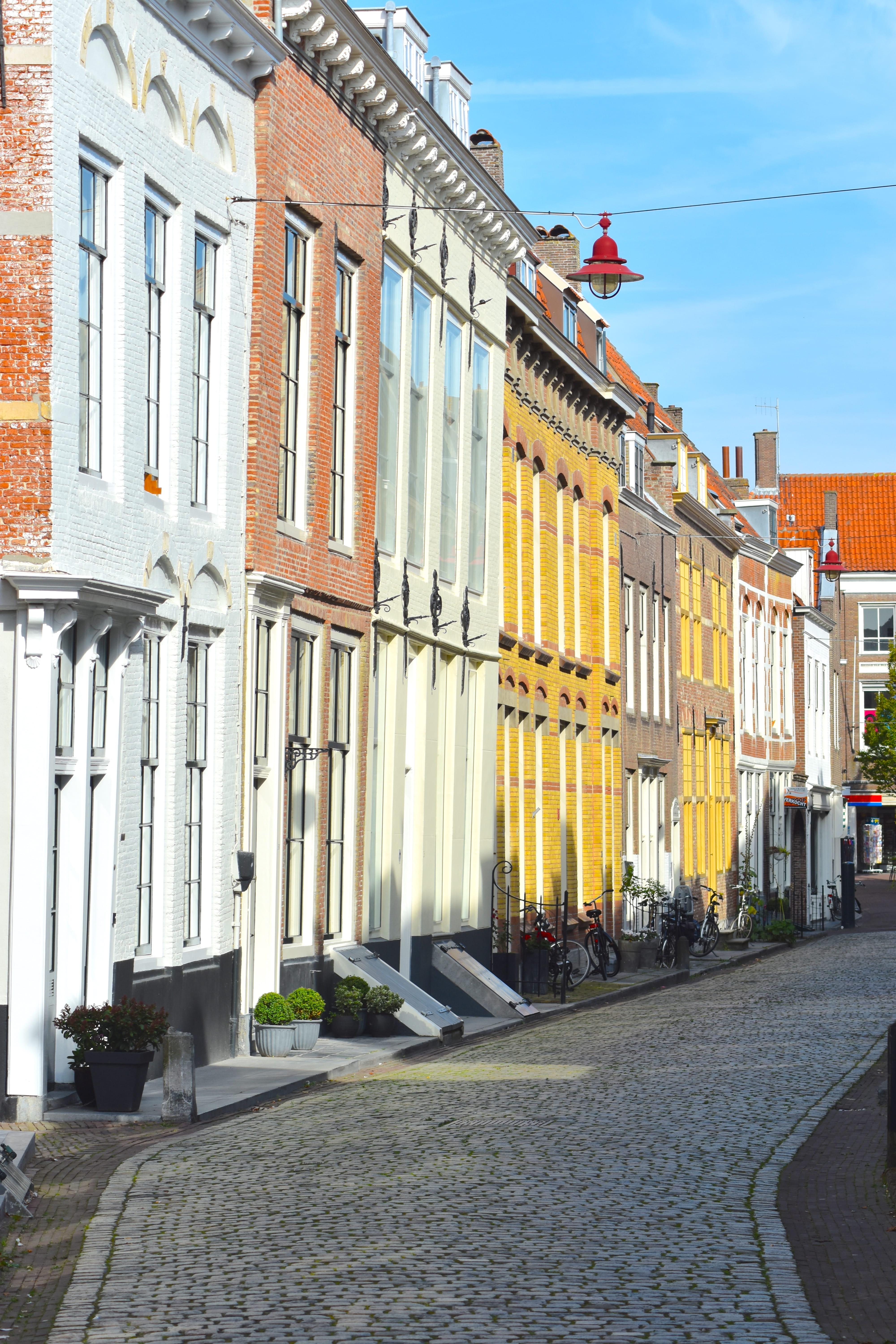 building exterior, row house, city, gasse, town, 5K, nature, residential district, building, day, sunlight, sidewalk, built structure, footpath, in a row, Phone HD Wallpaper