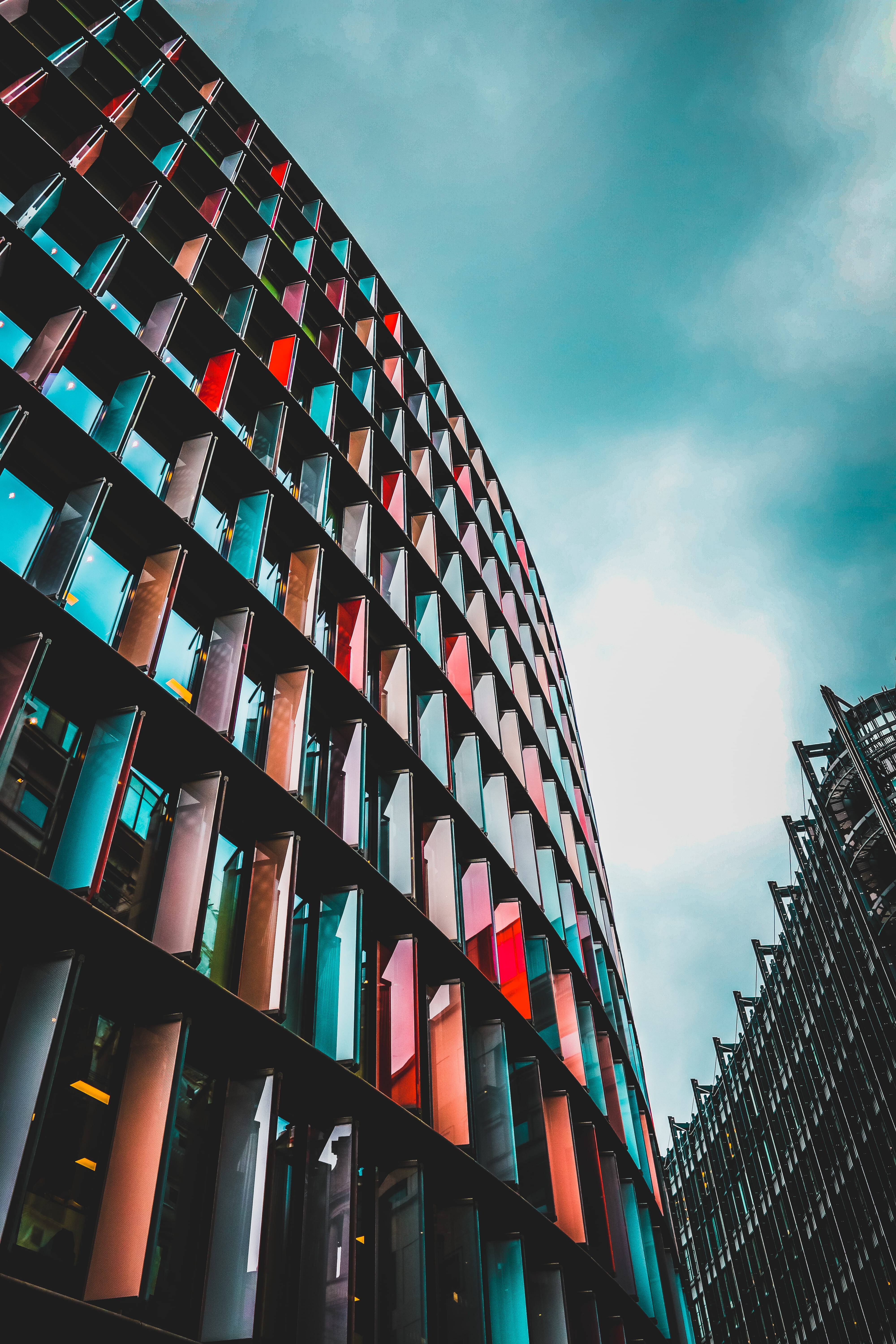 architecture, multicolored, window, built structure, geometric, cloud - sky, tall - high, 5K, no people, nature, office building exterior, sky, cloudy, Phone HD Wallpaper