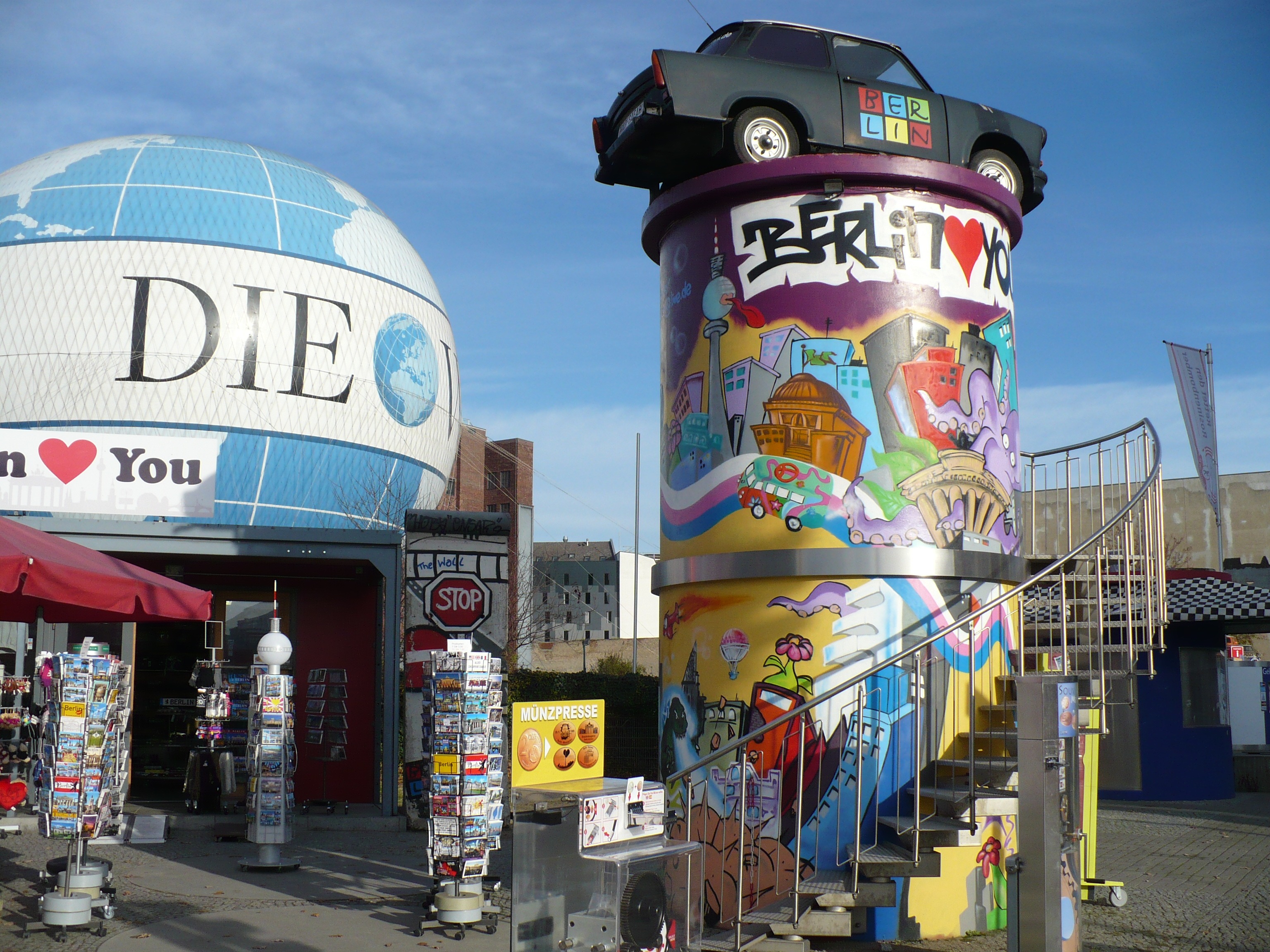 building exterior, built structure, multi colored, sky, western script, graffiti, city, hotels in berlin, street, art and craft, antique car, car, outdoors, HD Wallpaper
