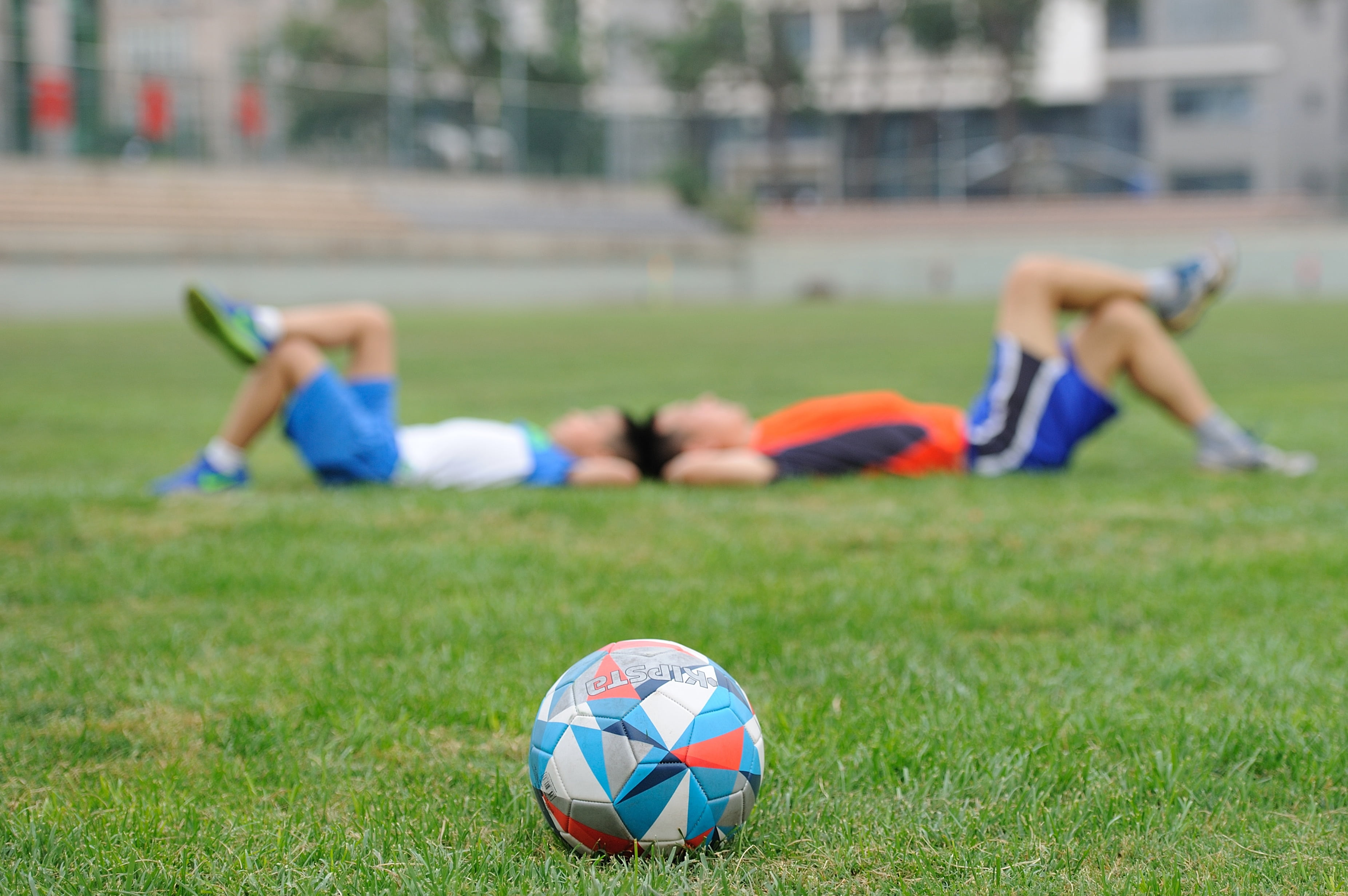 males, ball, near, teenager, soccer ball, lying, soccer player, kids, football, train, soccer field, plant, lying down, sport, nature, group of people, HD Wallpaper