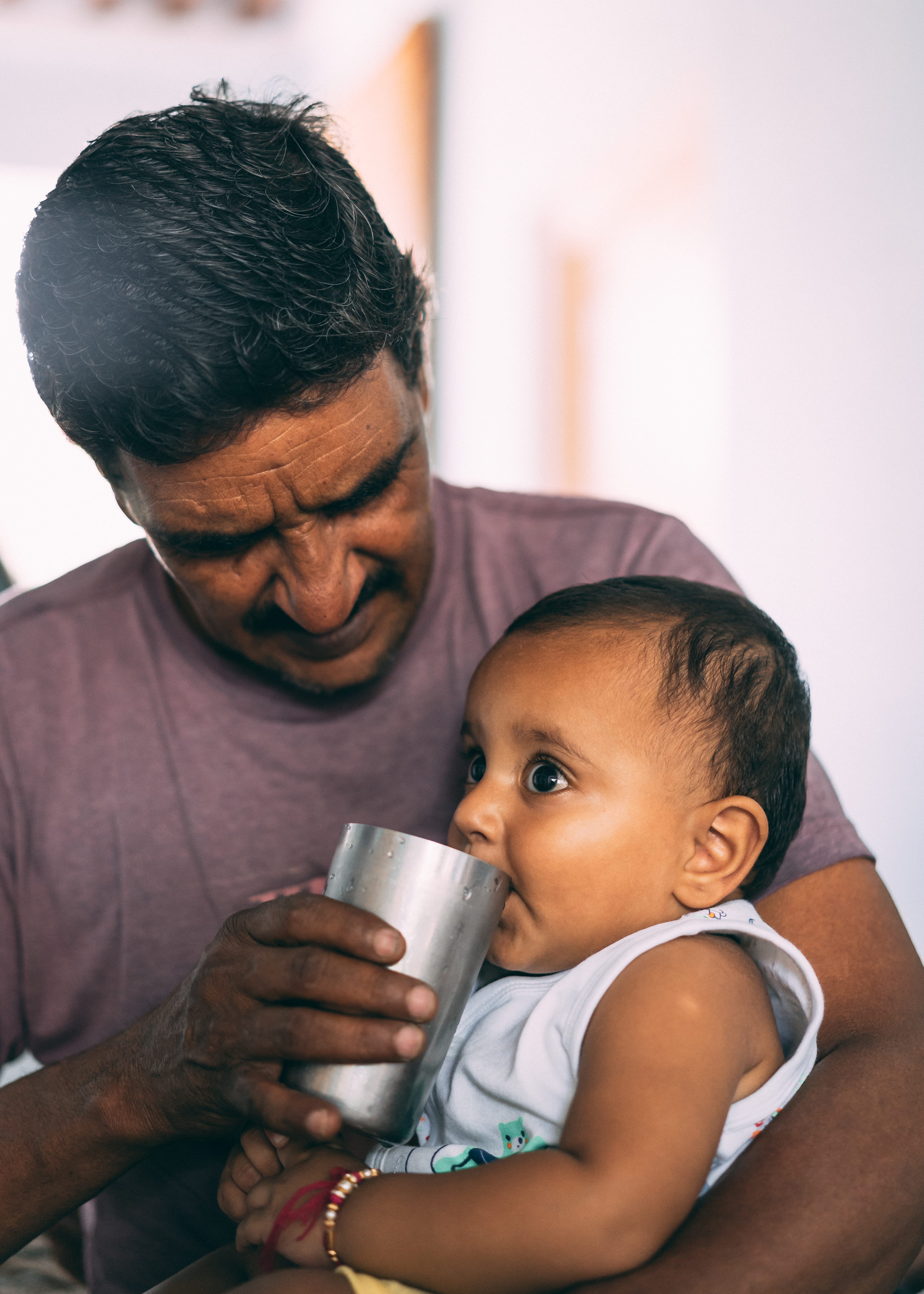 holding, adult, drink, positive emotion, mature men, males, grandfather, bonding, portrait, innocence, family with one child, 5K, bhalsona, child, real people, Phone HD Wallpaper