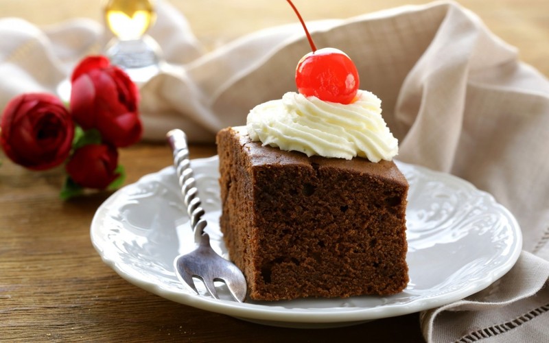 chocolate, whipped cream, cherries, fork, napkin, plates, cake