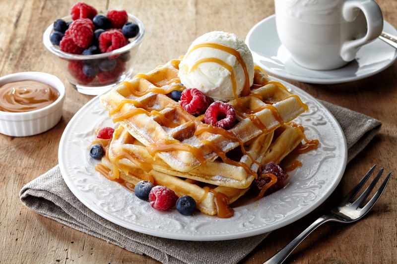 waffles, raspberries, ice cream, fork, coffee, blueberries