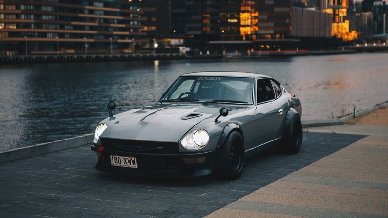 Nissan S30, Nissan Fairlady Z, Datsun 240Z, Japanese cars, JDM, sports car, Datsun, Nissan, city, silver cars, car, vehicle, river, front angle view, bolt-on fender flares, grey cars, pavers, outdoors