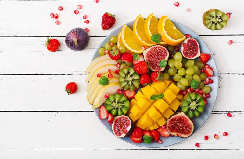 colorful, food, fruit, berries, salad, top view, strawberries, fig, orange (fruit), kiwi (fruit), grapes, mangos, pomegranate, mint leaves, wooden surface