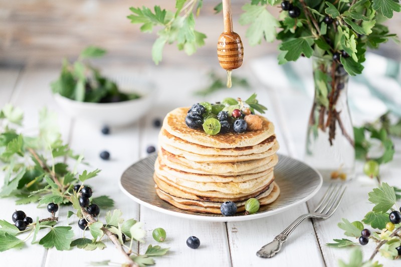 food, berries, fruit, pancakes, honey, blueberries, fork, leaves, wooden surface, dripping