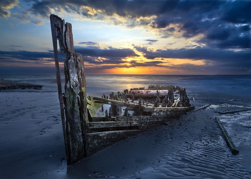 boat, coast, wreck, vehicle, sky, sunlight, outdoors