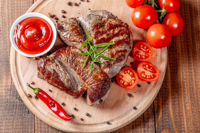 food, meat, tomatoes, cow, flesh, muscles, animals, death, rosemary, chilli peppers, Black pepper (Spice), ketchup, cutting board, wooden surface