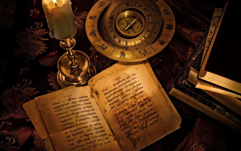 compass, candles, books