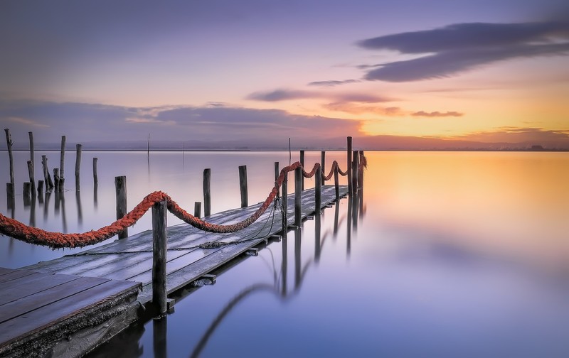water, sky, pier, outdoors, sunlight, sunset