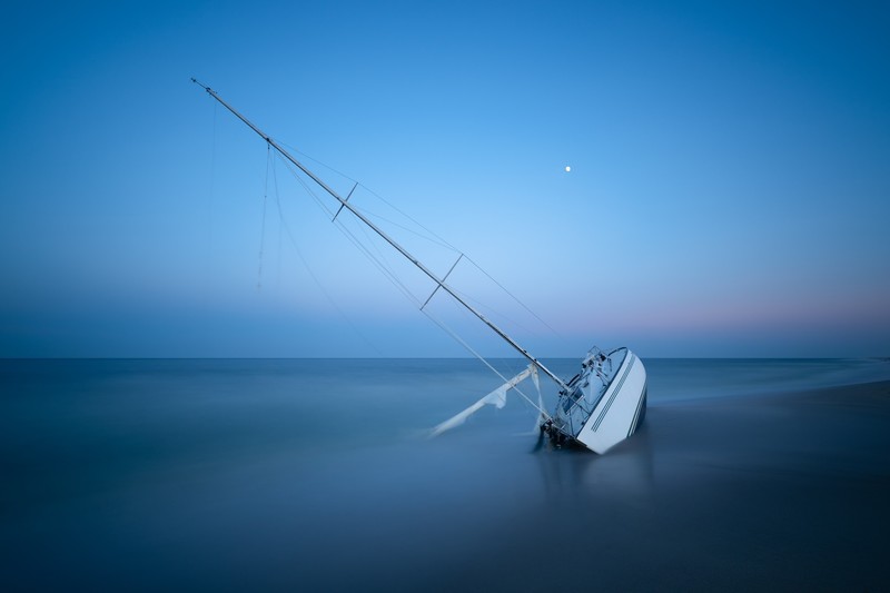 boat, blue, water, vehicle, outdoors, sea, sky, shipwreck