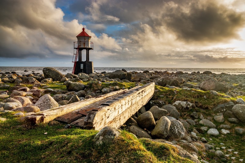 sky, stones, outdoors, lighthouse, rocks, horizon, coast, clouds