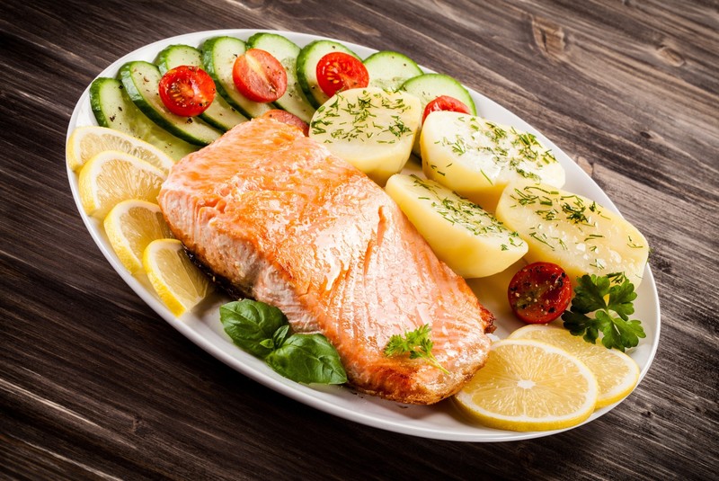 food, fish, potatoes, salmon, lemons, tomatoes, basil, cucumbers, wooden surface