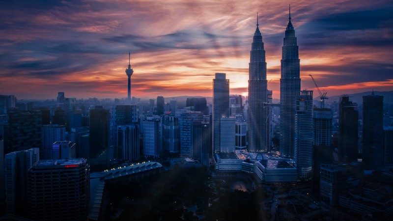 architecture, building, skyscraper, cityscape, Kuala Lumpur, Malaysia, Petronas Towers, tower, sunset, sun rays, clouds, cranes (machine)
