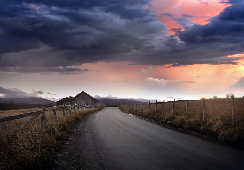 road, sky, clouds, outdoors, dirt road, fence, landscape, barn, overcast