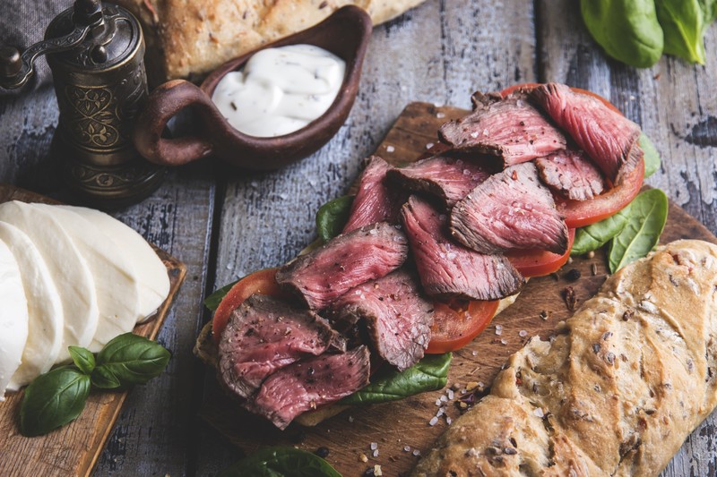 food, still life, meat, cutting board, basil, tomatoes, bread, Mozzarella, salt, wooden surface