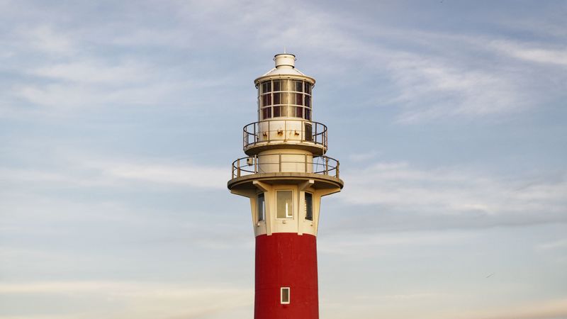 lighthouse, structure, grass, striped, 4k