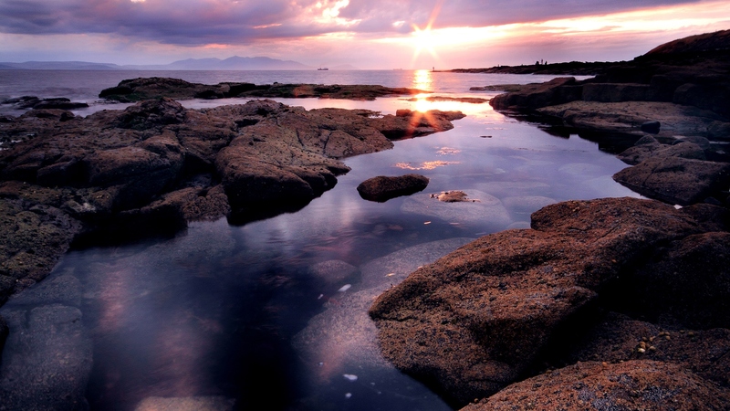 rocks, ocean, sunlight, colors, sunset, sky, clouds, sea, rays, nature, reflection