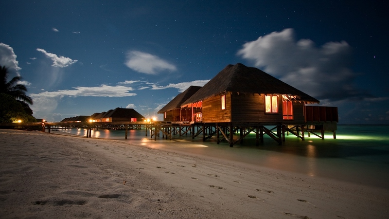 pretty, resort, house, clouds, lights, beach, splendor, bungalows, beauty, lovely, romance, holiday, houses, ocean, sky, trees, palms, water, paradise, footprints, colorful, beautiful, sea, sand, night, stars, vacation, exotic, romantic, view, pier, colors, seashore, peaceful, summer, nature, tropical