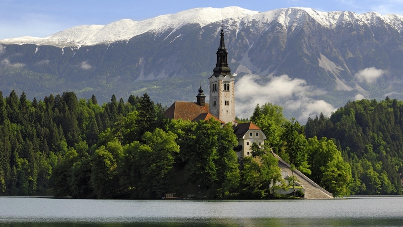 chappel, water, trees, mountains