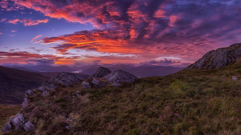 mountains, sunset, stones, grass, clouds, landscape, 4k