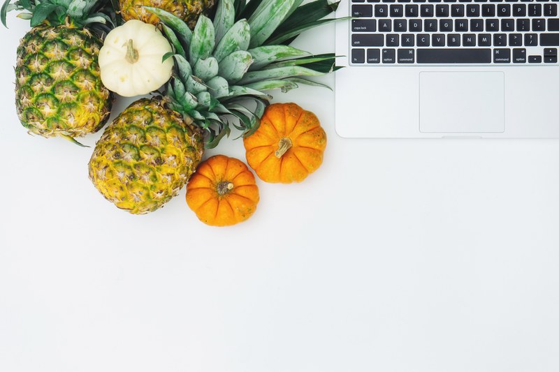 top view of pineapples and miniature pumpkins and a macbook, _fruits and macbook 4k