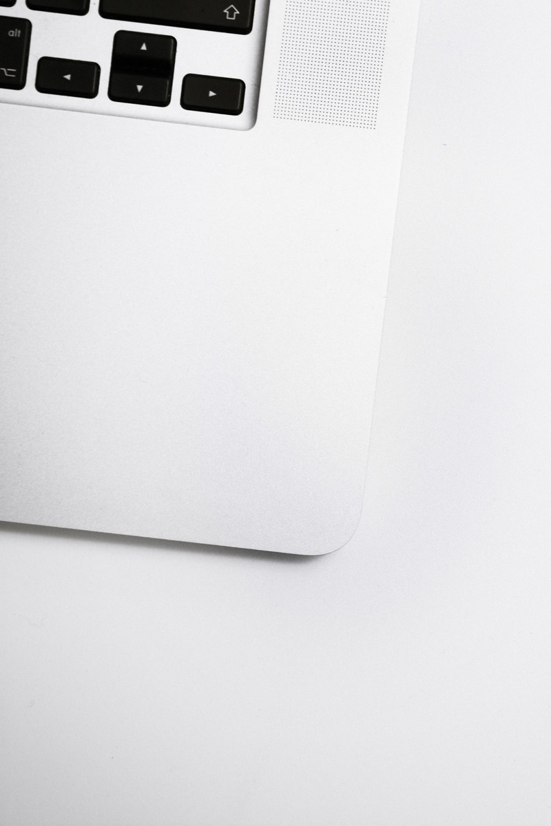 an overhead shot of of a the edge of a laptop keyboard, laptop keyboard edge 4k