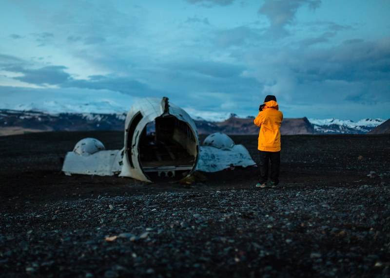person looks at a abandoned plane crash site in solheimasandur plane wreck, worth it 4k