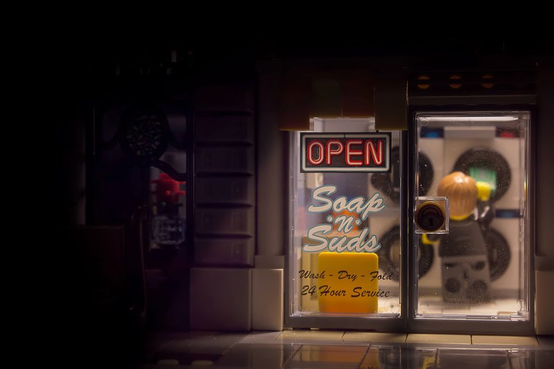 a coin laundry storefront built with lego blocks, lego money laundering 4k