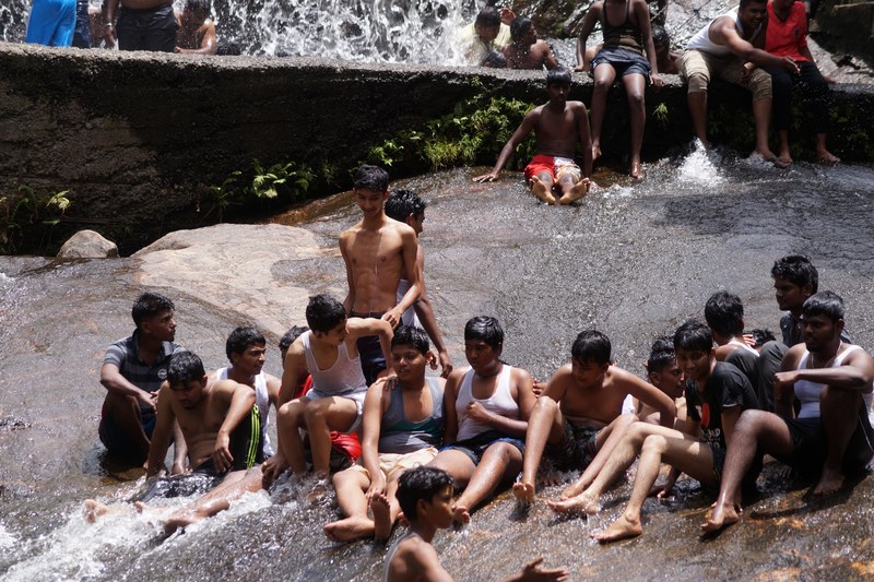 group of students enjoying on waterfalls 4k