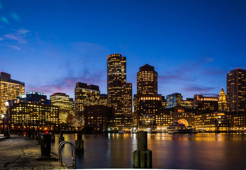 a city skyline at night seen from the docks, city from docks at night 4k