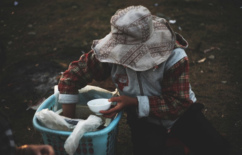a woman serves rice from a basket, women with rice 4k