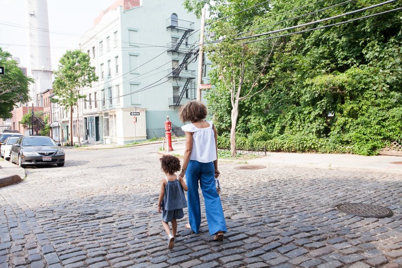 cobblestone walking person and child 4k