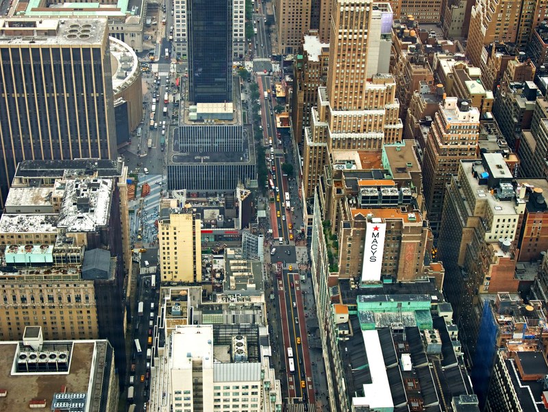 drone view of the rooftops of buildings and the busy new york city streets, building city manhattan and roof 4k
