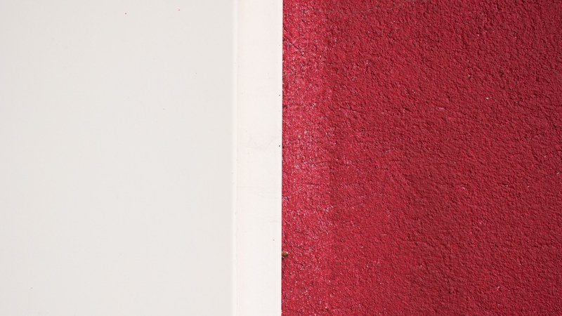 a straight line dividing parts of a wall painted white and red, white and red wall pattern 4k