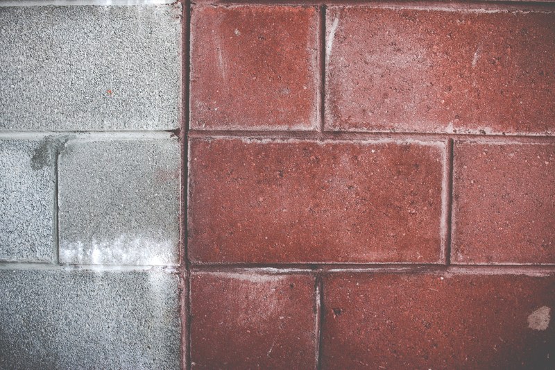 a block brick wall painted light gray and red, red and gray big brick wall 4k