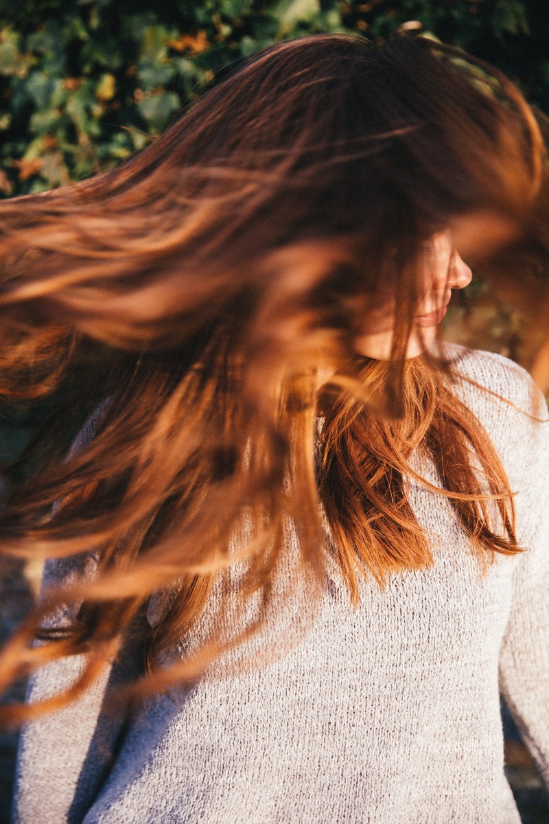 woman shaking out her hair freely, hair freedom 4k